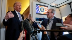 US President Donald Trump speaks to reporters on board Air Force One, following his visit to China on May 15. 
