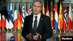 U.S. Secretary of State Antony Blinken talks to the press following a North Atlantic Council Meeting at NATO's heaquarters in Brussels on November 13. 