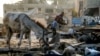 Gaza - A donkey feeds near people gathering at the site of a destroyed building in the aftermath of overnight Israeli bombardment in the Japanese neighbourhood in the northwest of Khan Yunis in the southern Gaza Strip on July 28, 2025. 