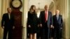 U.S. President-elect Donald Trump (2ndR) answers questions as his wife Melania Trump and Senate Majority Leader Mitch McConnell (R-KY) watch on Capitol Hill in Washington, U.S., November 10, 2016.