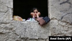 Një grua migrante, fotografi ilustruese.