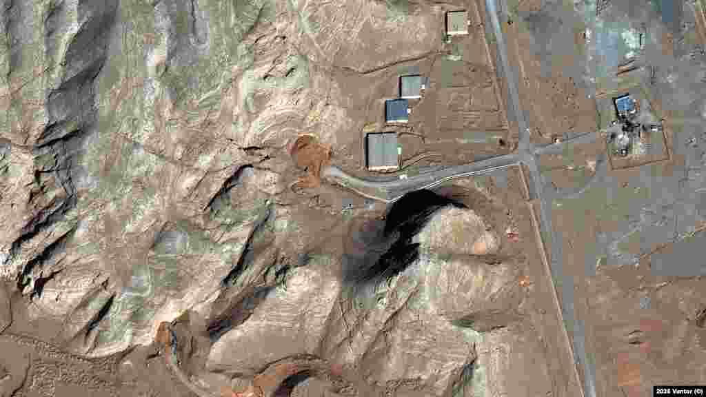 A satellite image taken on February 10 shows what appears to be piles of dirt (darker shaded earth in the center of the photo) filling up the entrances to a tunnel complex at the Isfahan Nuclear Research Center in central Iran.