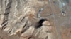A satellite image taken on February 10 shows what appears to be piles of dirt (darker shaded earth in the center of the photo) filling up the entrances to a tunnel complex at the Isfahan <a href="https://en.wikipedia.org/wiki/Isfahan_Nuclear_Technology/Research_Center" target="_self" class="wsw__a">Nuclear Research Center</a> in central Iran.