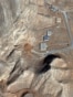 A satellite image taken on February 10 shows what appears to be piles of dirt (darker shaded earth in the center of the photo) filling up the entrances to a tunnel complex at the Isfahan <a href="https://en.wikipedia.org/wiki/Isfahan_Nuclear_Technology/Research_Center" target="_self" class="wsw__a">Nuclear Research Center</a> in central Iran.