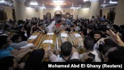 Mourners gather at the Sacred Family Church for the funeral of Coptic Christians who were killed on Friday in Minya, Egypt, May 26, 2017.