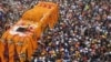 Sikh devotees gather around a bus carrying the Guru Granth Sahib, the Sikh holy book, during a religious procession on the occasion of the birth anniversary of Guru Nanak Dev, the founder of Sikhism, in Punjab Province, Pakistan, on November 15.