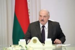 President Alyaksandr Lukashenka: "Russia's attempt to hide the 'tail' now and claim that the arrival of this group was agreed on with us -- this is total nonsense."m (file photo)