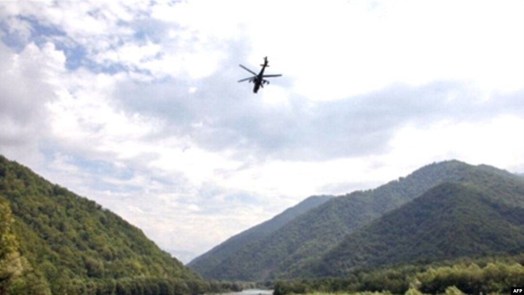 An Abkhaz helicopter flies over the remote Kodori Gorge near the town of Chkhalta