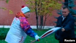 Оьрсийчоь -- Кремлна уллехула дIахьош Грецехь латийна Олимпан цIе дIаяйра, иза цIетухургаца латош ву хIара стаг, Москох ГIад 6, 2013