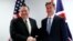 U.S. Secretary of State Mike Pompeo (left) poses with British Foreign Secretary Jeremy Hunt at the European Council in Brussels on May 13.