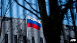 The Russian flag flies outside the Russian Embassy in Washington, D.C.