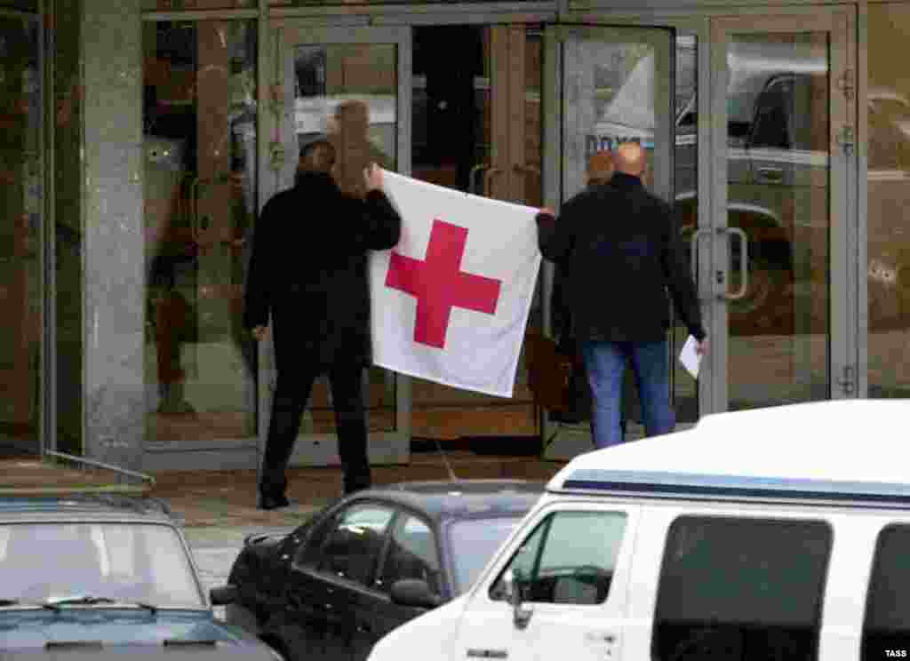 Representatives of the Red Cross gain access to the theater on October 25.