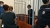 Azat Miftakhov in the defendant's cage at a court hearing in Moscow earlier this week. 