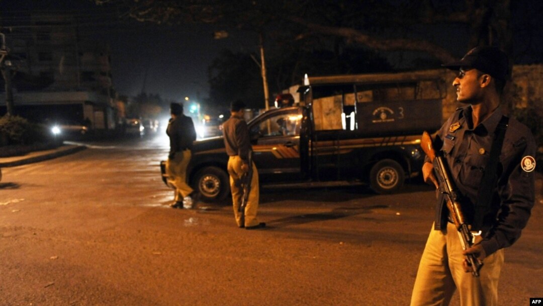 Pakistani police keep watch at a security checkpoint in Karachi on February 17, after military officials confirmed the arrest of Mullah Bardar.