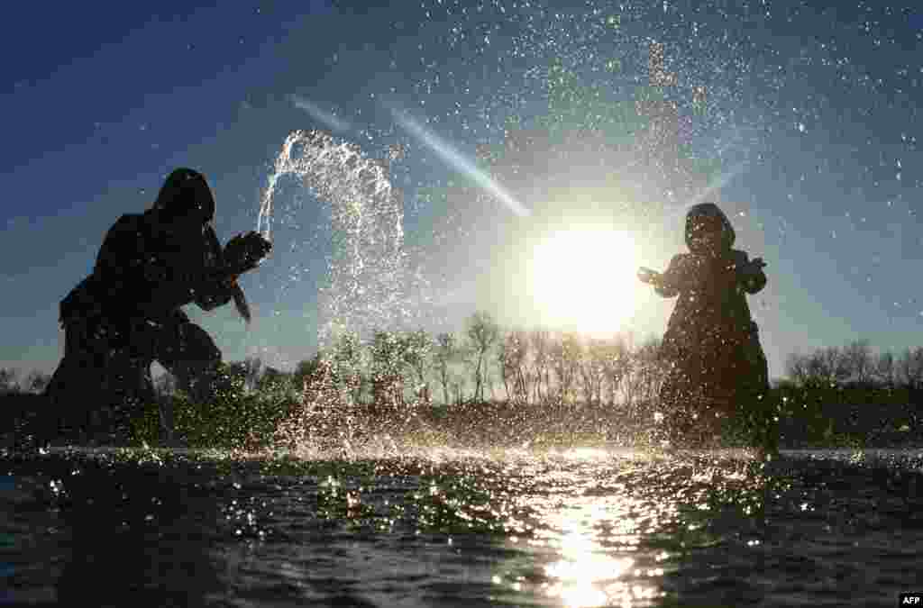 Afghan children play in the Heri Rud River in Herat. (AFP/Aref Karimi)