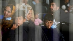 Evacuees from Afghanistan wait to fly to the United States or another safe location in a makeshift departure gate inside a hanger at the United States Air Base in Ramstein, Germany. (file photo)