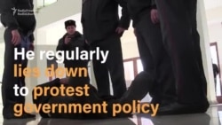 Armenian Protester Stands Trial Lying Down