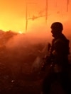 Рятувальники працюють на місці влучання російського безпілотника у приватне підприємство на околиці Сум, 15 травня 2025 року