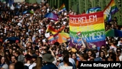 People attend a gay pride parade in Budapest in July 2021. The LGBT community and other critics say the government stigmatizes sexual minorities and stifles discourse on sexual orientation.