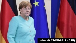 German Chancellor Angela Merkel arrives to address journalists after meeting with German parliamentary groups and ministers to discuss the so-called Brexit referendum at the Chancellery on June 24 in Berlin.