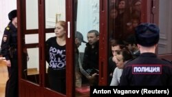 Suspects in the subway bombing case attend a court hearing in St. Petersburg in April.