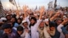 Supporters of Islamic political party Jamiat Ulma-e-Islam shout slogans at a rally in Peshawar on September 7 to mark the anniversary of the Pakistani parliament's 1974 bill deeming Ahmadis "non-Muslims."
