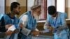 Afghan election commission workers in Kabul prepare ballot papers for counting after the country's presidential election on September 28. 