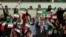 Iranian women - most of them family of players, federation employees and relatives, are allowed for the first time to take part at the friendly soccer match between Iran and Bolivia at the Azadi Stadium in Tehran, October 16, 2018