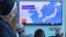 In Seoul, residents watch a news report on North Korea firing a ballistic missile.