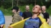 Ukrainian POWs are seen after a swap at an unknown location in Ukraine