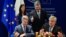 Ukrainian President Petro Poroshenko (top right) looks on as he attends the signing ceremony for a new visa-liberalization regime with the European Union in Strasbourg on May 17.