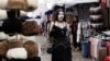 A woman walks through a market in Ashgabat, Turkmenistan on March 17. 