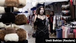 A woman walks through a market in Ashgabat, Turkmenistan on March 17. 