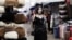 A woman walks through a market in Ashgabat, Turkmenistan on March 17. 