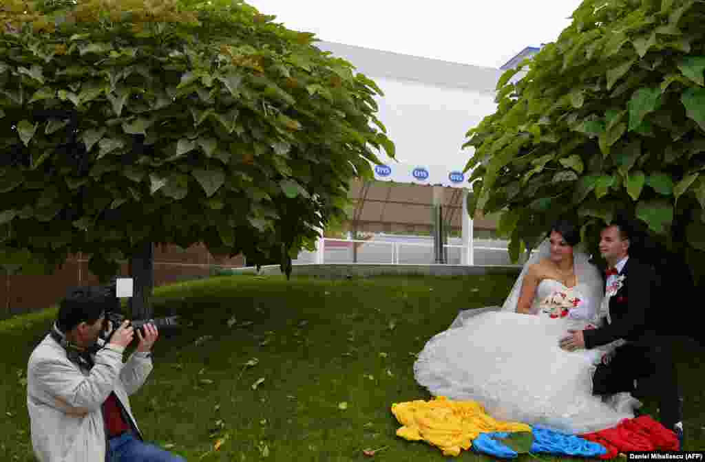 A photographer takes pictures of newlyweds in the city of Drochia, north of Chisinau.