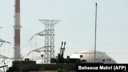 File photo - An anti aircraft machine-gun is seen in front of the reactor building of the Bushehr nuclear power plant, February 26, 2018