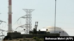 File - An anti aircraft gun is seen in front of the reactor building of the Bushehr nuclear power plant, February 26, 2018