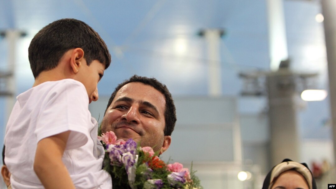 Iranian nuclear scientist Shahram Amiri is welcomed by family members upon his arrival at Imam Khomeini Airport in Tehran on July 15.