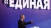 Russian President Vladimir Putin delivers a speech at the United Russia party congress in Moscow last month with the words "United" in the background.