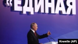 Russian President Vladimir Putin delivers a speech at the United Russia party congress in Moscow last month with the words "United" in the background.