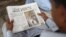 A Pakistan man reads a copy of the English-language Dawn newspaper in Karachi. Reporters Without Borders has condemned the disruption in distribution of Pakistan's oldest newspaper after it published a controversial interview with ousted Prime Minister Nawaz Sharif.