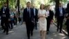 French President Emmanuel Macron walks with Moldovan President Maia Sandu in Chisinau on June 15.