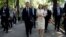 French President Emmanuel Macron walks with Moldovan President Maia Sandu in Chisinau on June 15.