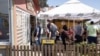 People wait to receive doses of the Chinese Sinopharm COVID-19 vaccine at a restaurant in Kragujevac, Serbia, in March.