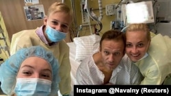 Russian opposition politician Aleksei Navalny and his family members pose for a picture at the Charite hospital in Berlin on September 15.