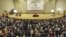 Lawmakers take the oath of office during the first session of Iraq's new parliament on June 14 in Baghdad.