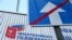 RUSSIA -- RYAZAN, MARCH 25, 2020. An "End Of One-Way Traffic Road" road sign and a billboard for the forthcoming national referendum on proposed amendments to the Russian Constitution.