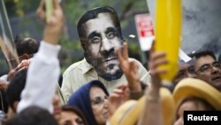 A mask depicting Iranian president Mahmud Ahmadinejad is seen during a protest against his presence at the UN General Assembly in New York on September 26.