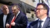 Бойко Борисов, Делян Пеевски и Даниел Митов (от ляво надясно) на фона на емблематичния лъв пред сградата на МВР в София. Колаж: Свободна Европа