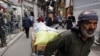 Iranians walk in Tehran's grand bazaar, March 18, 2020